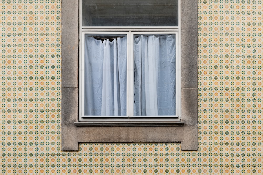 a window that has a curtain in it