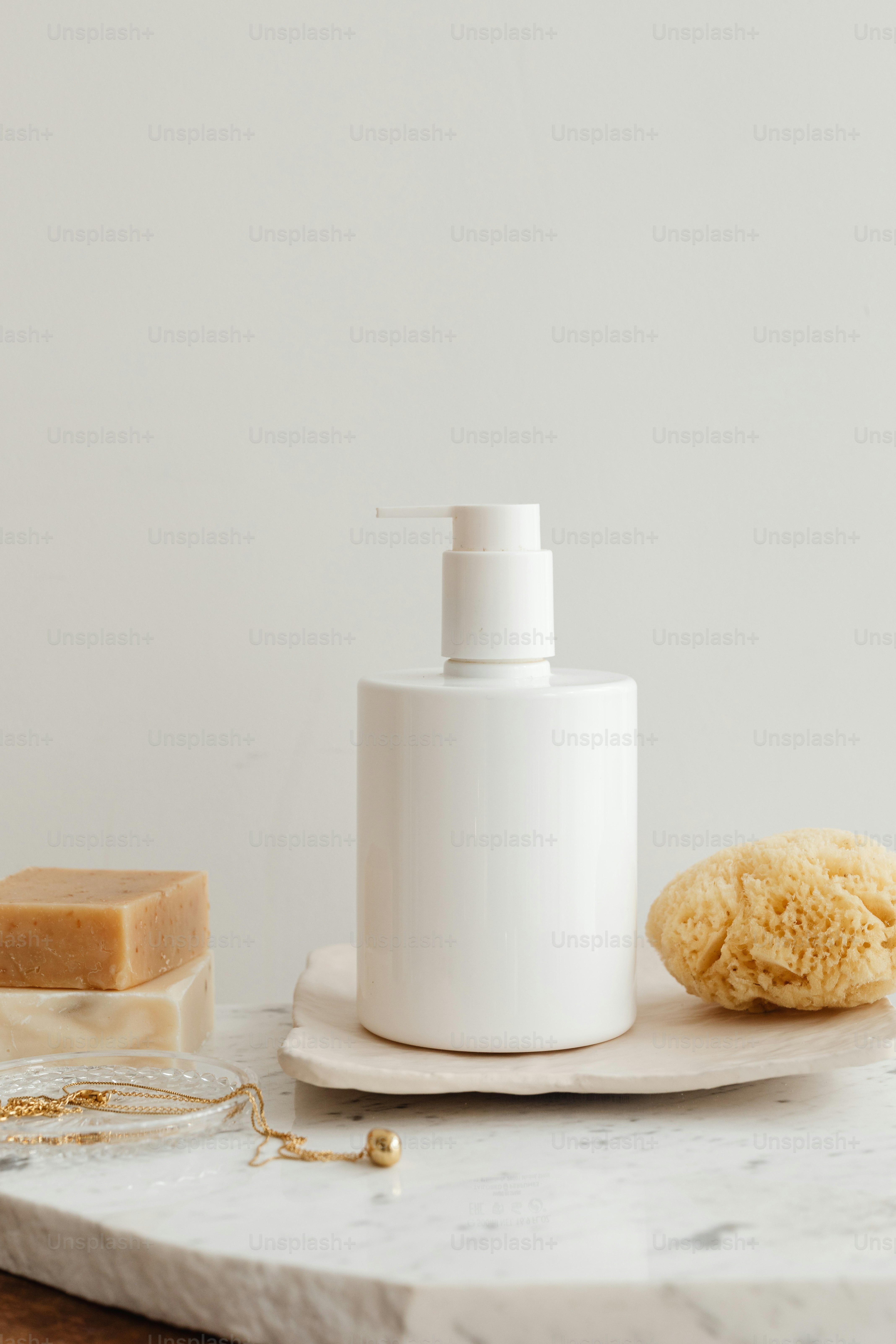 a soap dispenser sitting on top of a marble counter