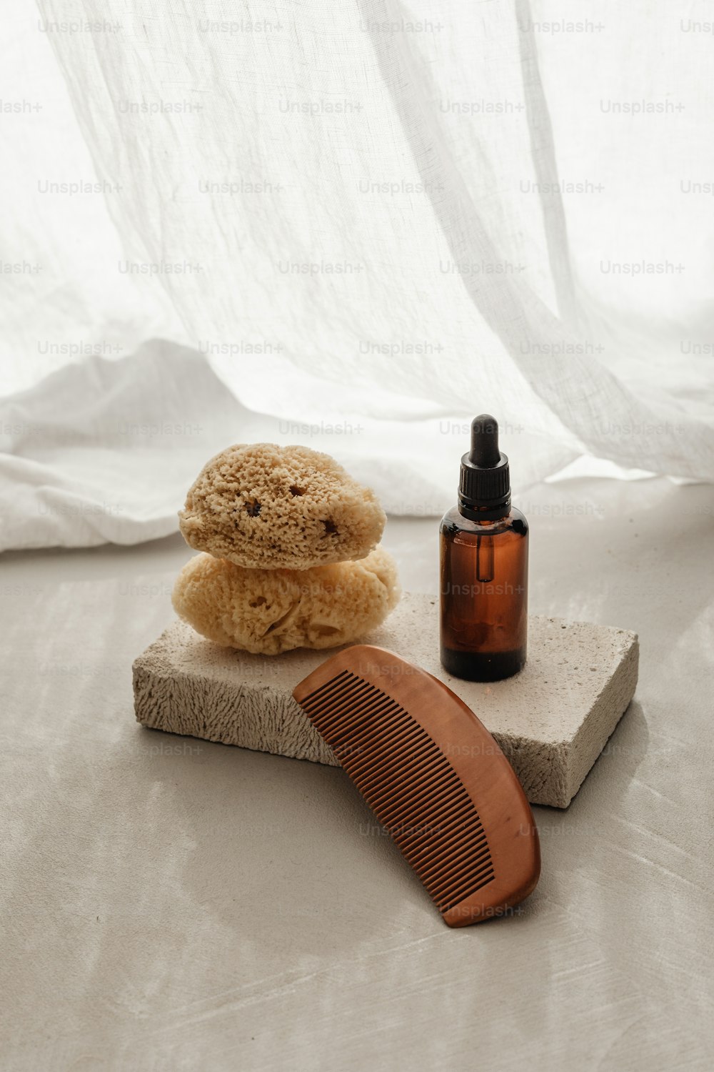 a wooden comb sitting on top of a stone block