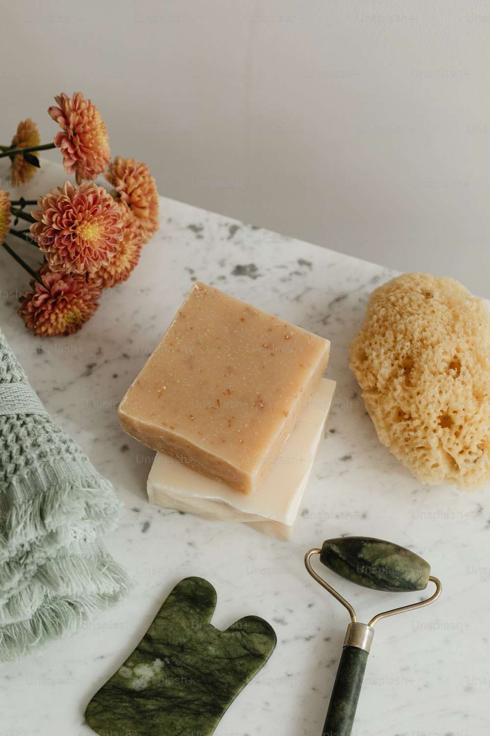 a white counter topped with soap and a pair of scissors