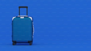 una valigia blu su ruote su sfondo blu