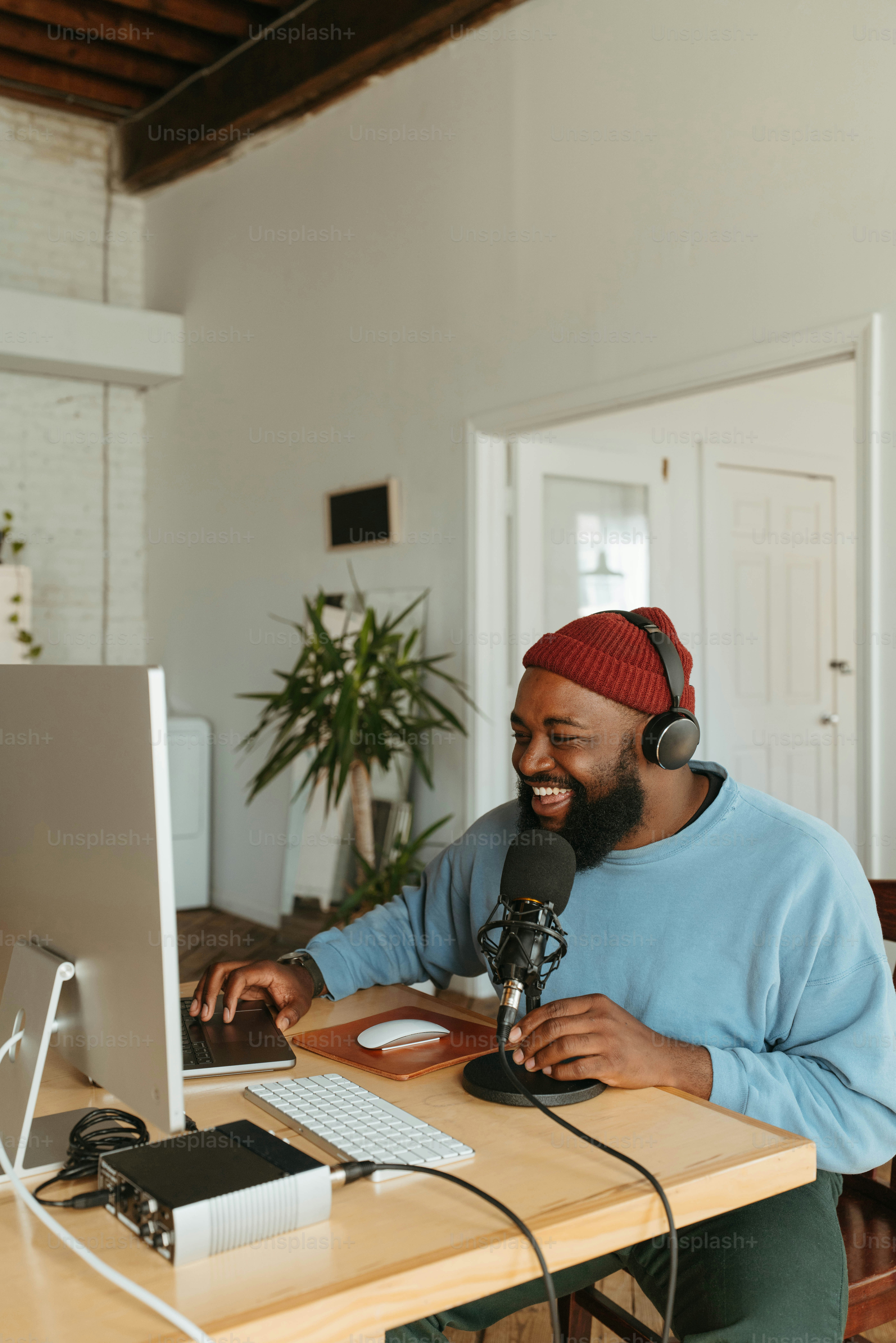 a man sitting at a desk in front of a computer