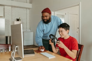 a man holding a magnifying glass next to a boy