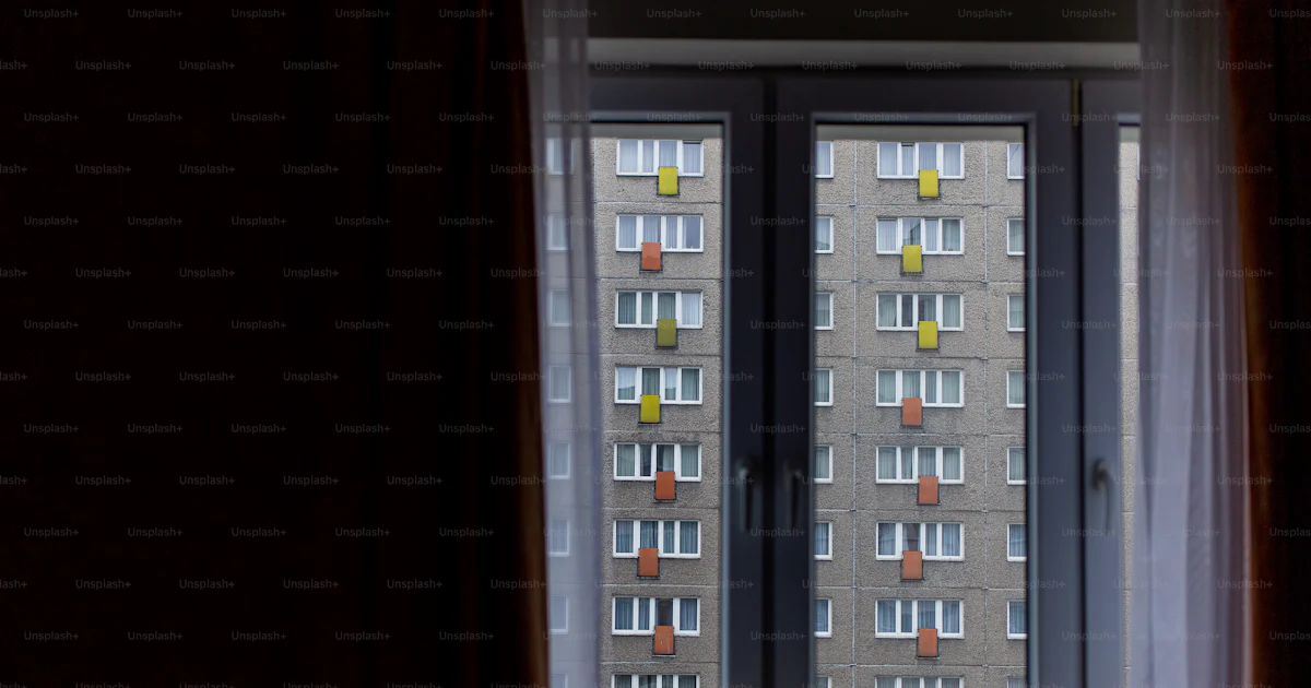 A view of a building through a window photo – Building Image on Unsplash