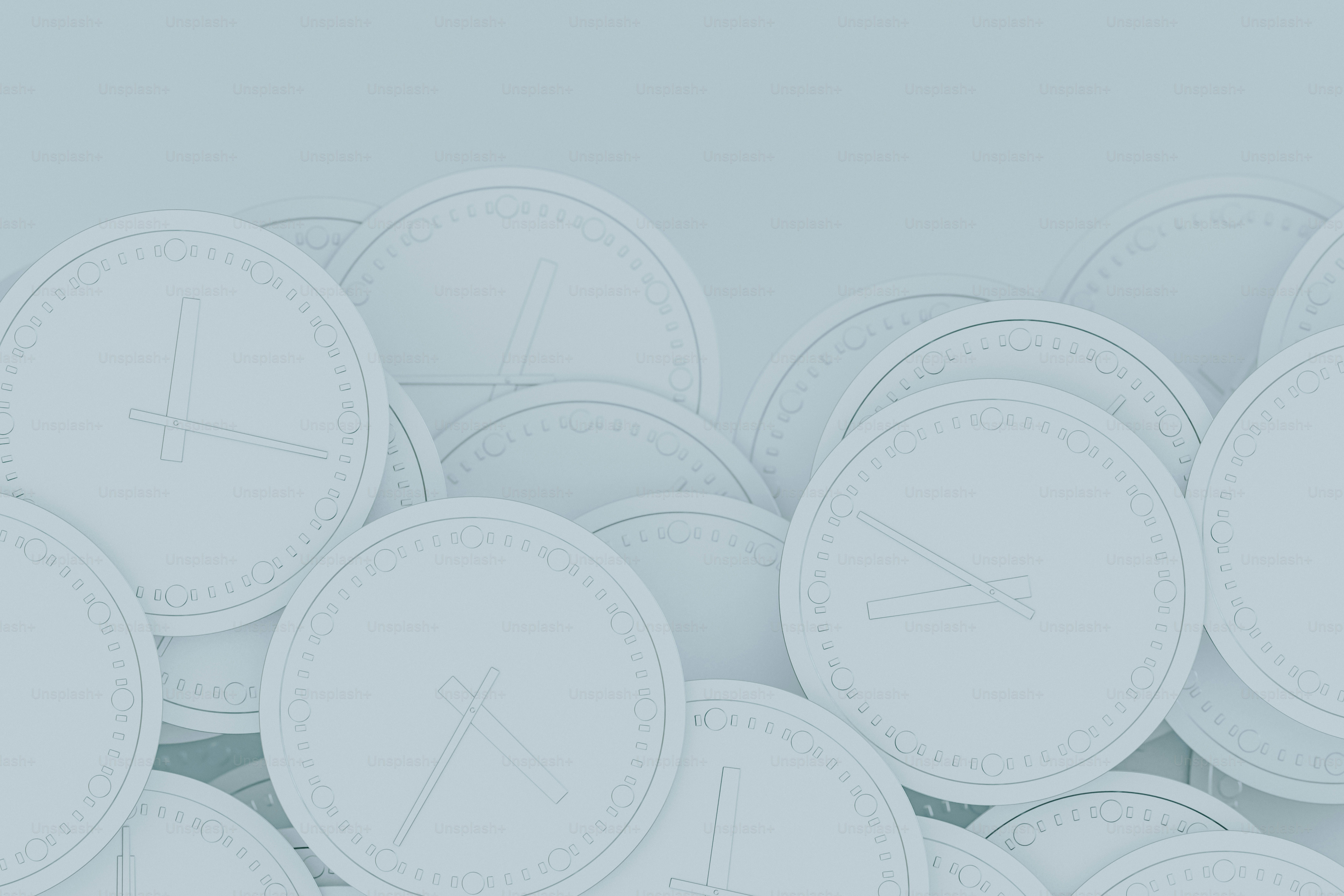 a bunch of white clocks sitting on top of each other