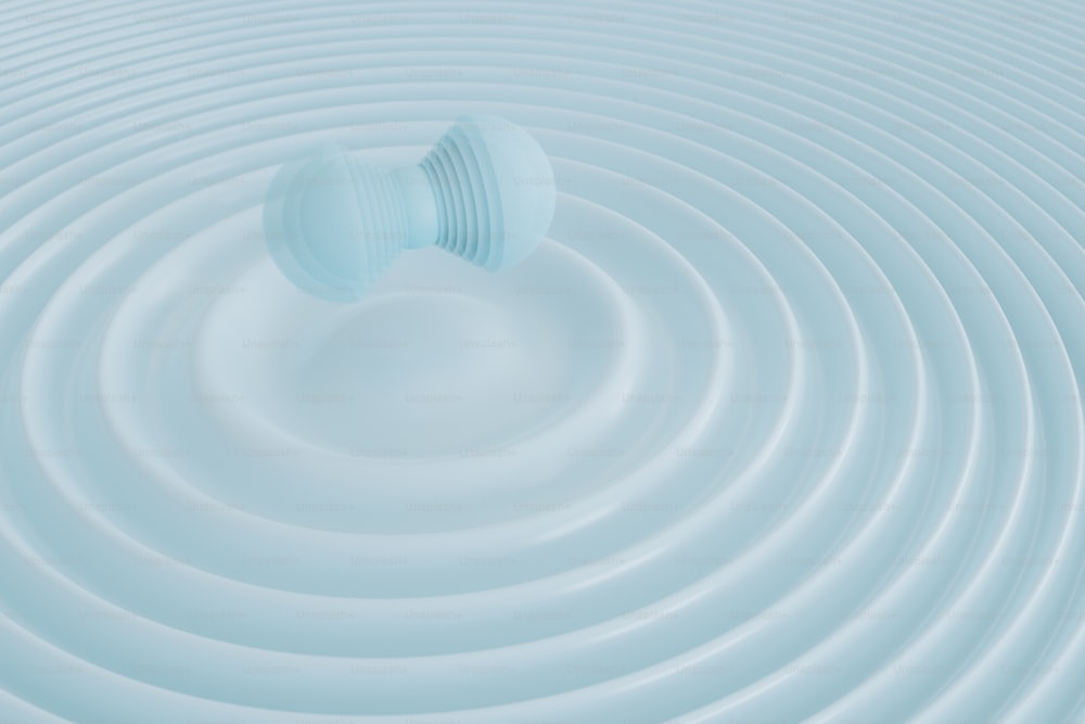 a white circular object floating on top of a body of water