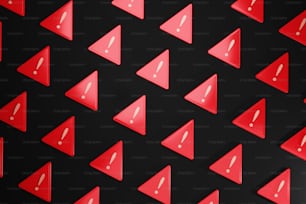 Un grupo de objetos en forma de triángulo rojo sobre un fondo negro