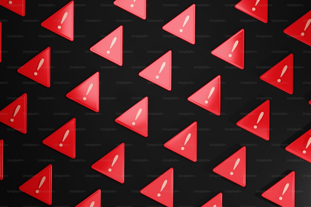 a group of red triangle shaped objects on a black background