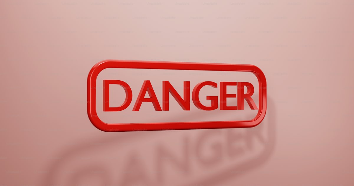 A red danger sign with the word danger on it photo – Risk Image on Unsplash