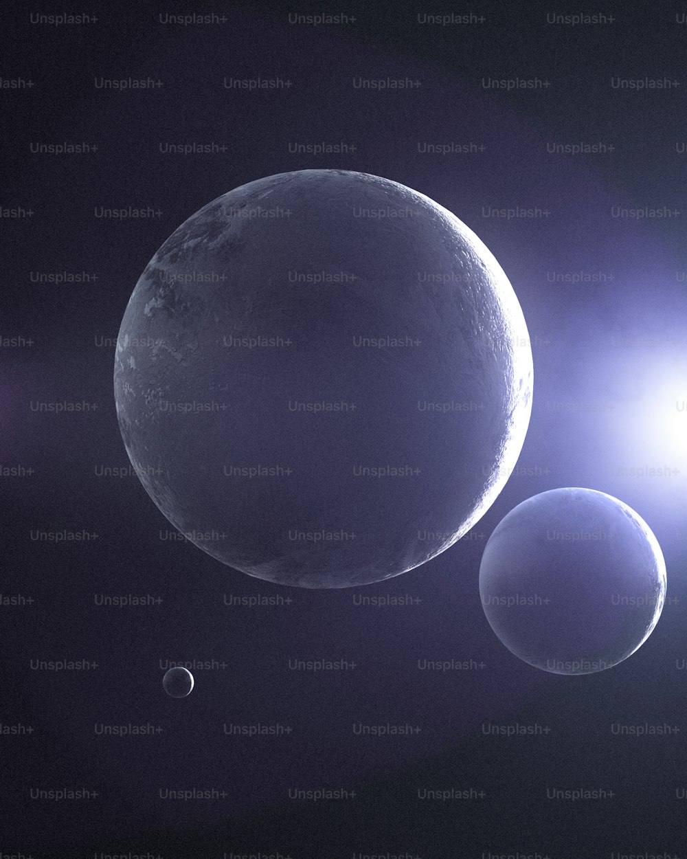 três planetas são mostrados no céu escuro