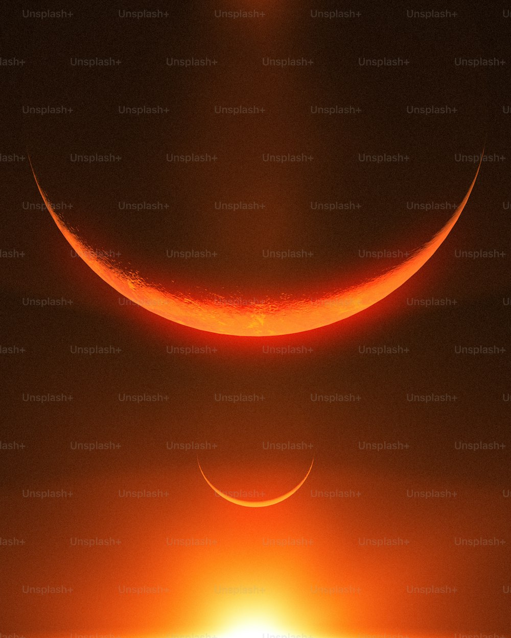 the sun is setting over the horizon of a crescent