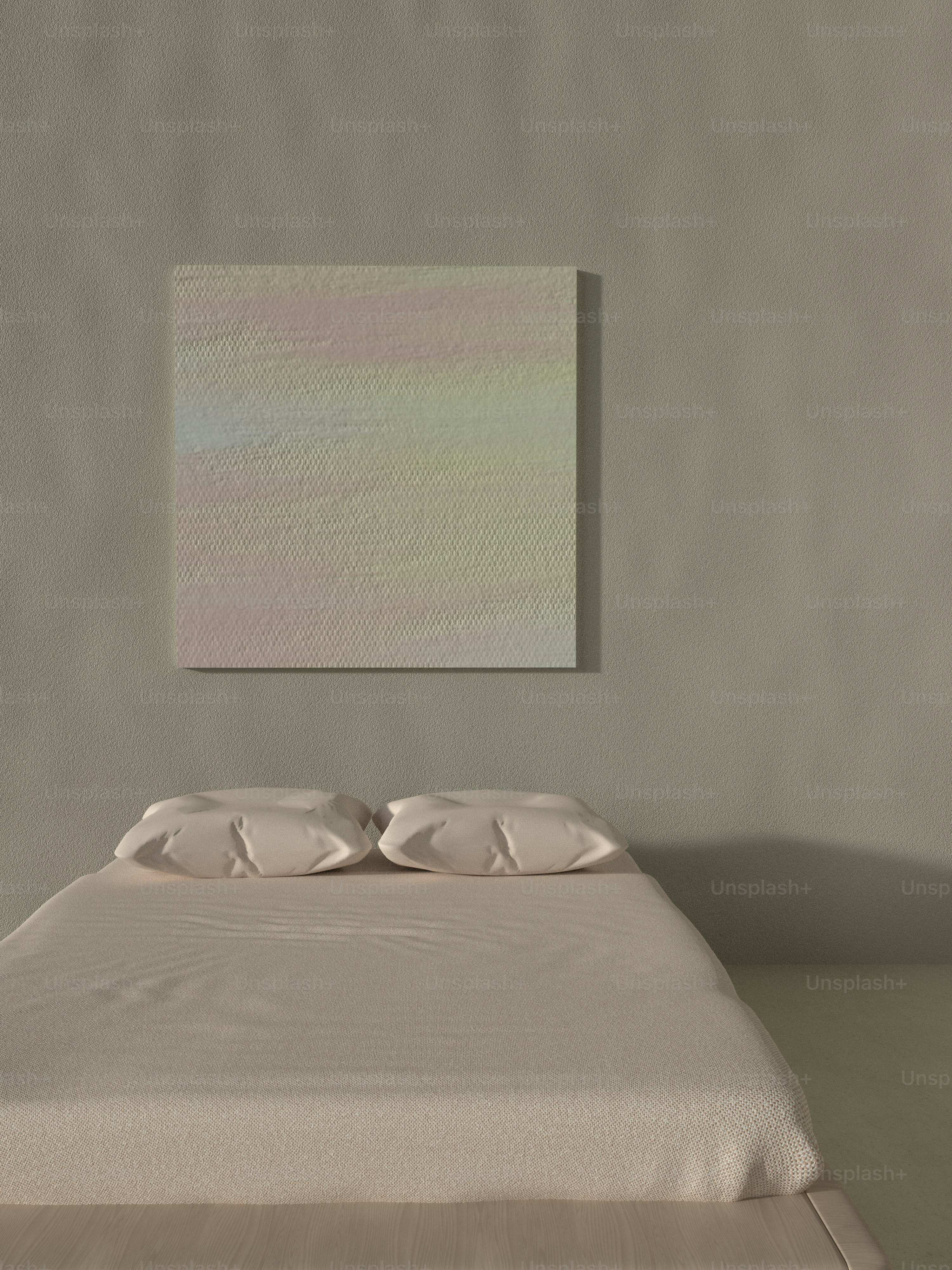a bed in a room with a painting on the wall