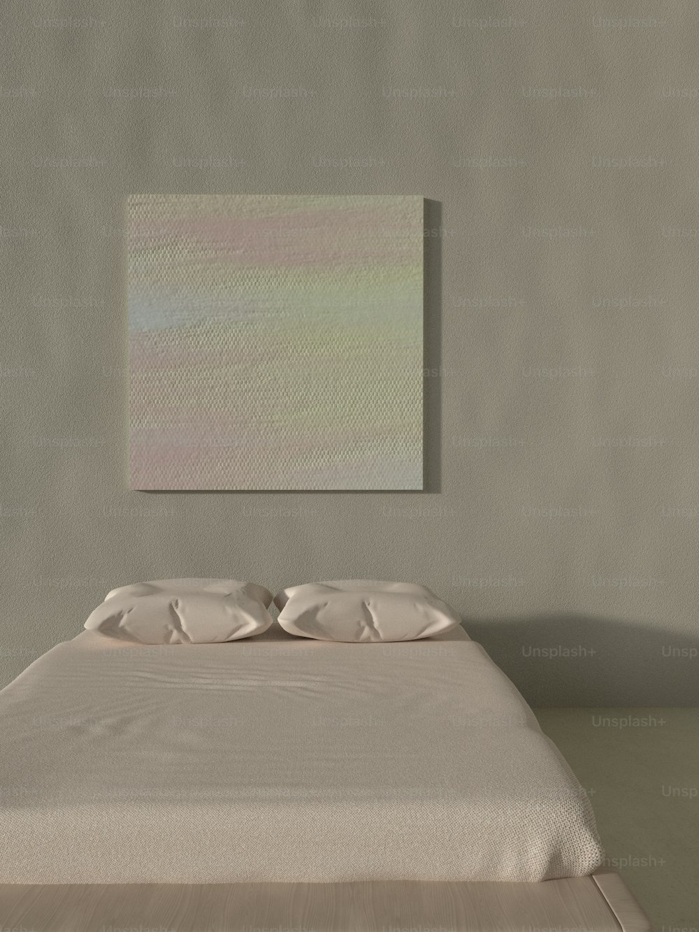 una cama en una habitación con una pintura en la pared