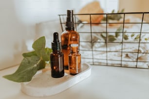 three bottles of essential oils sitting on a counter