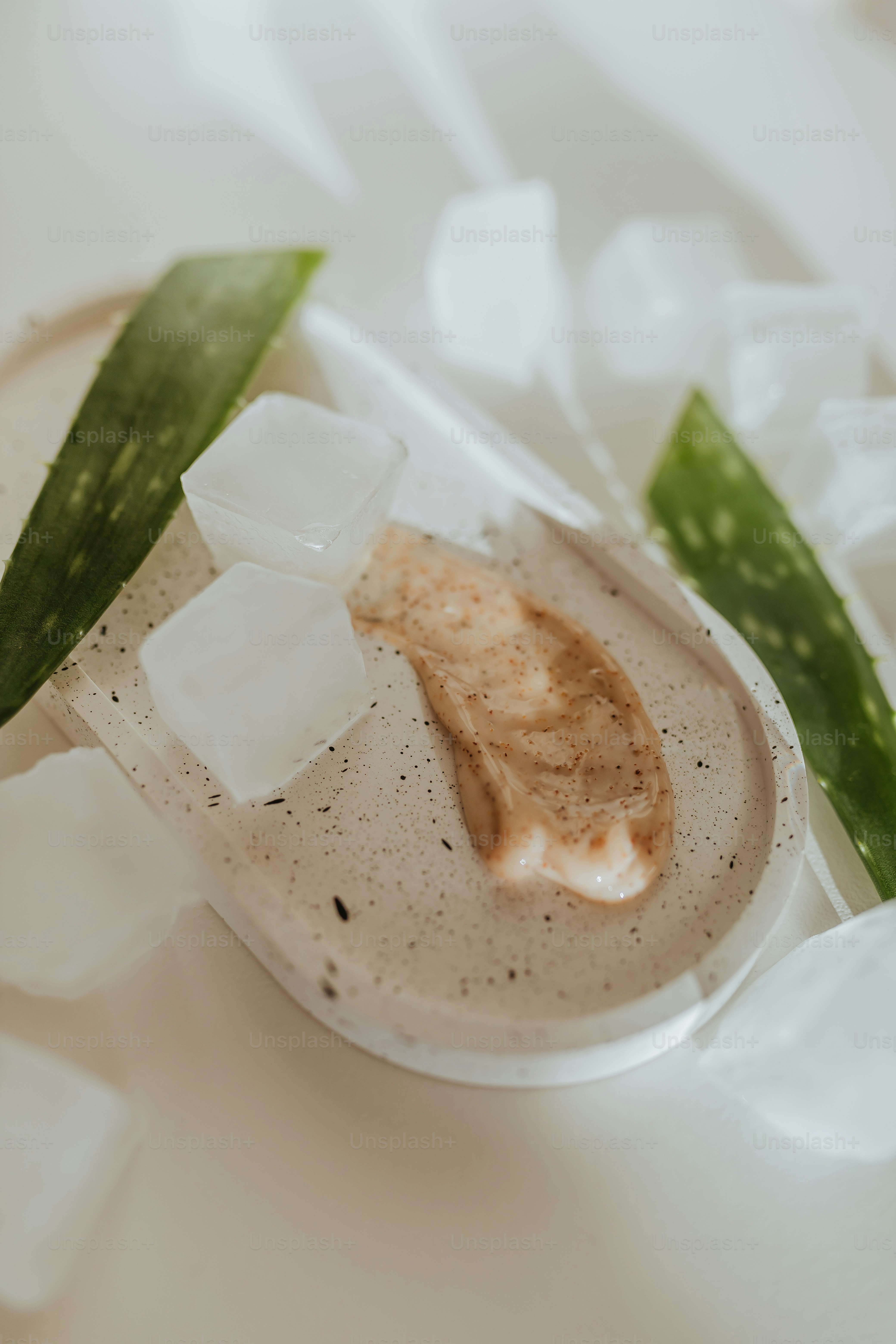 Woman using aloe vera as one of her natural skin care remedies at home