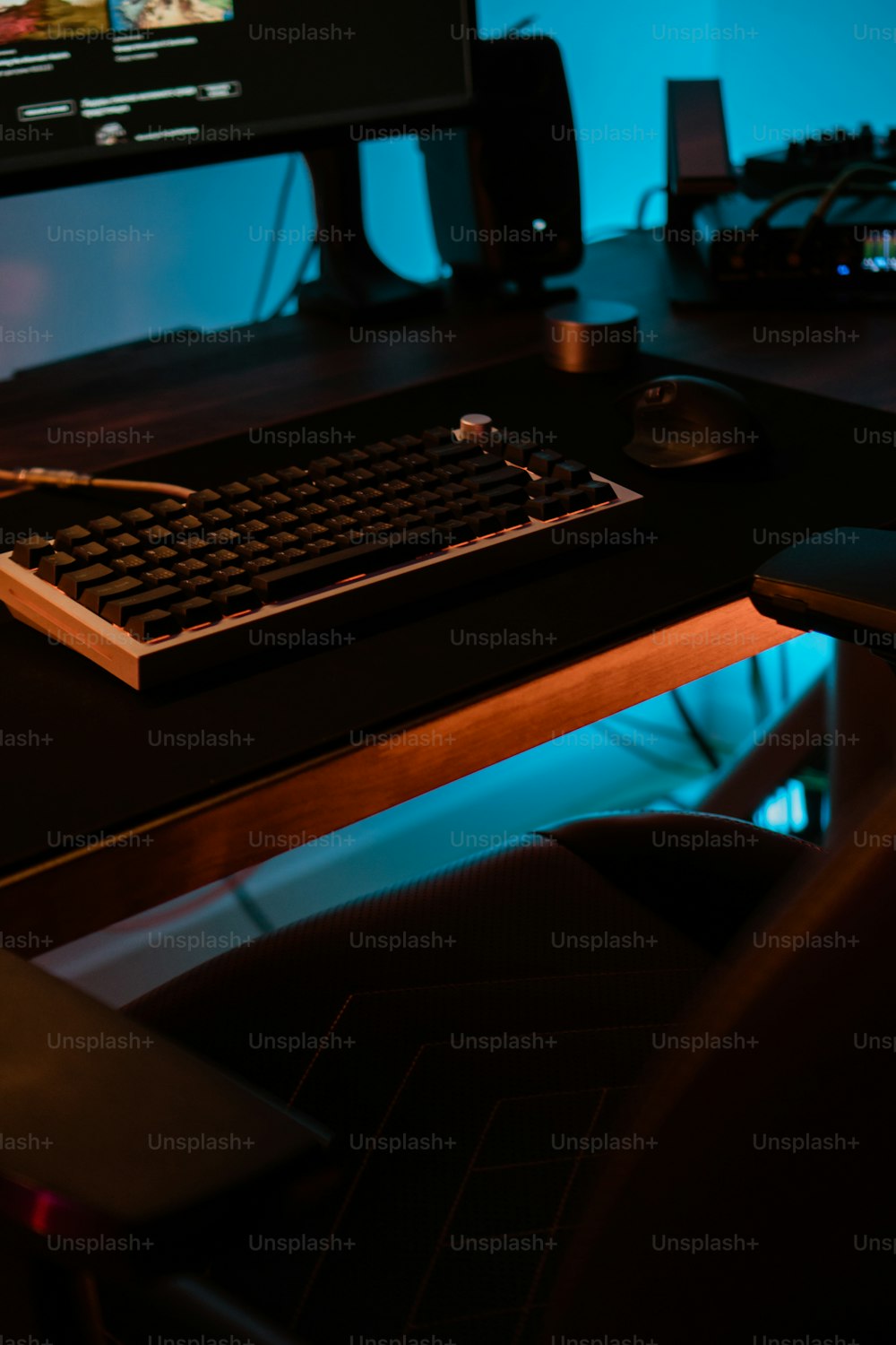 a computer keyboard sitting on top of a wooden desk