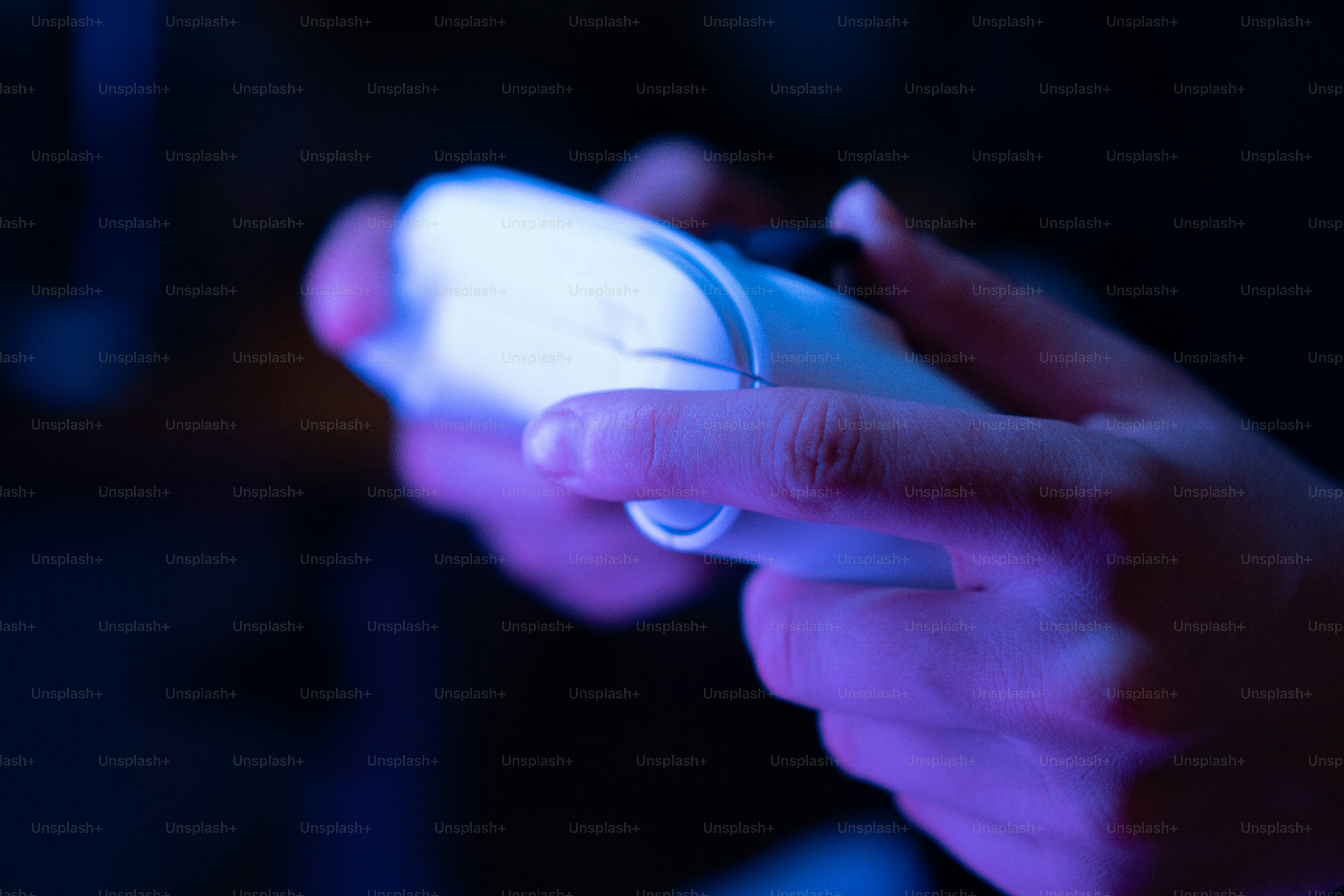 a person holding a video game controller in their hands