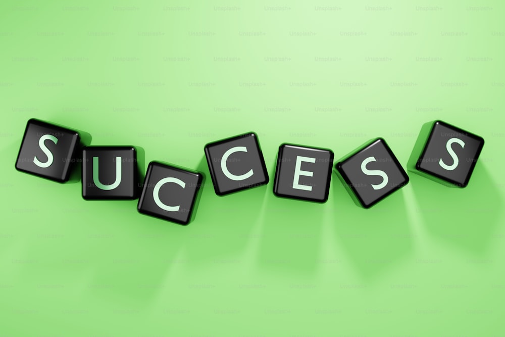 the word success spelled with cubes on a green background