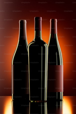 three bottles of wine sitting on a table