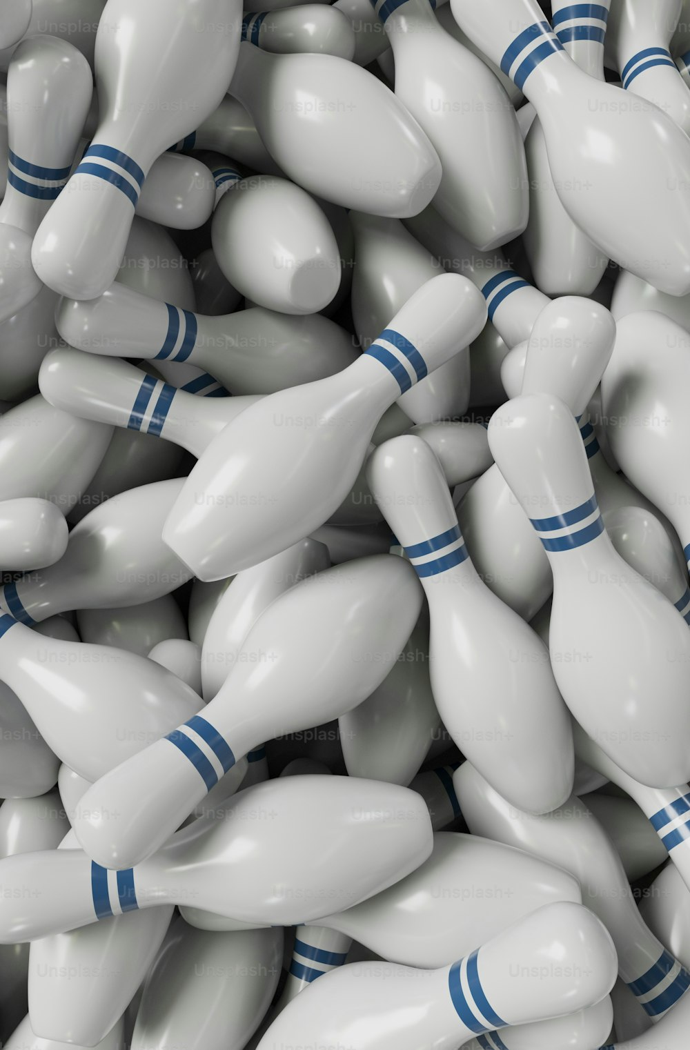 a pile of white bowling pins with blue pins on them