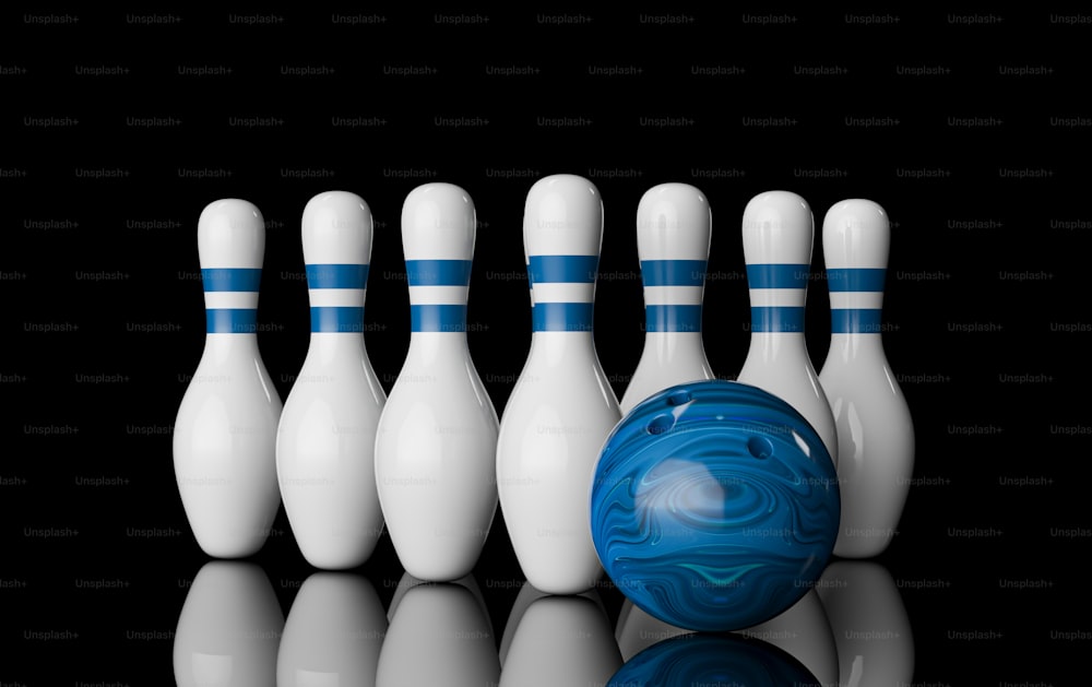 un gruppo di birilli da bowling e una palla da bowling
