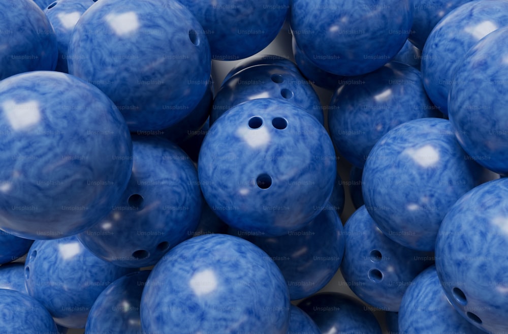 a pile of blue balls with holes in them