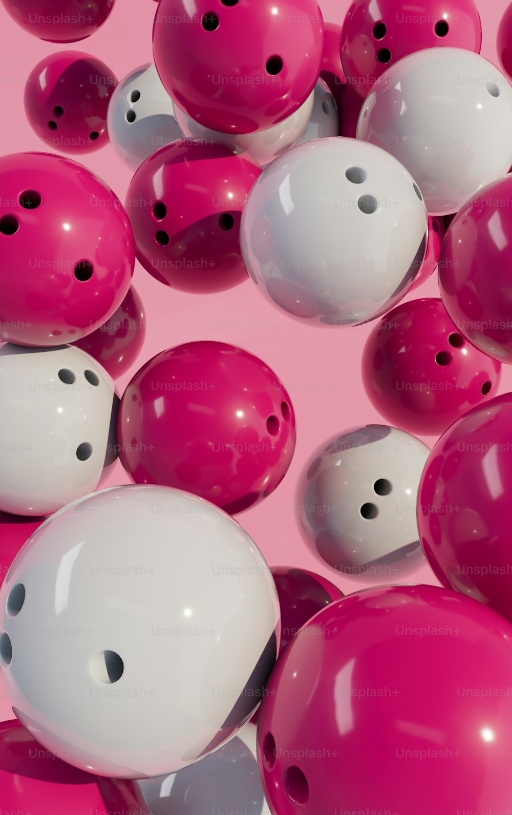 a bunch of pink and white bowling balls