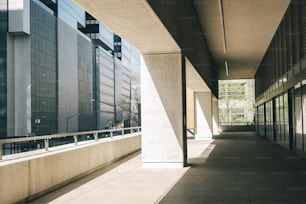 an empty walkway between two buildings in a city
