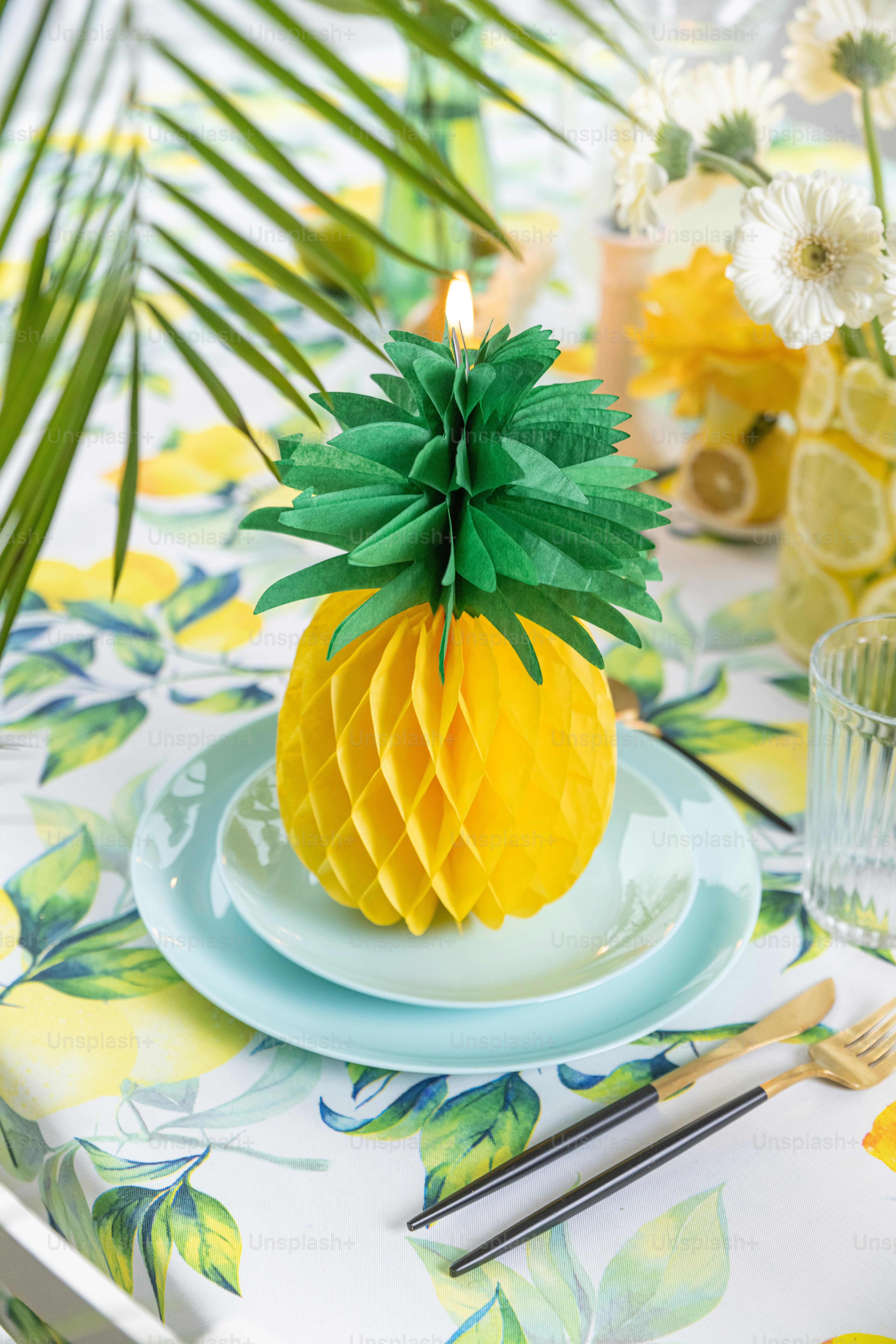 a pineapple on a plate on a table