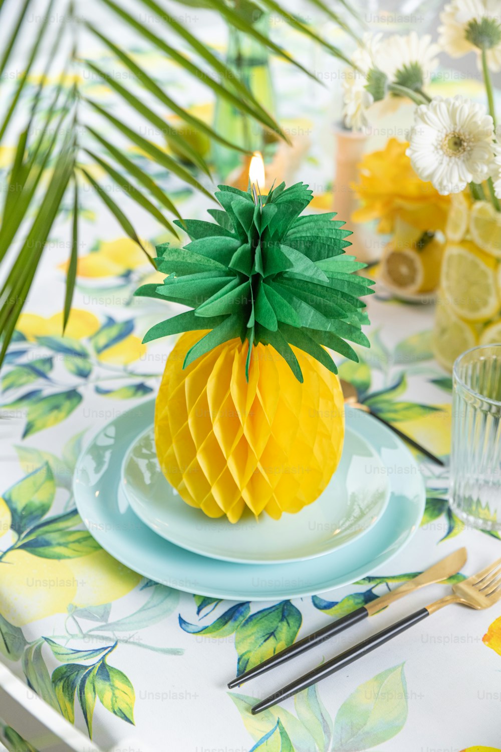 a pineapple on a plate on a table