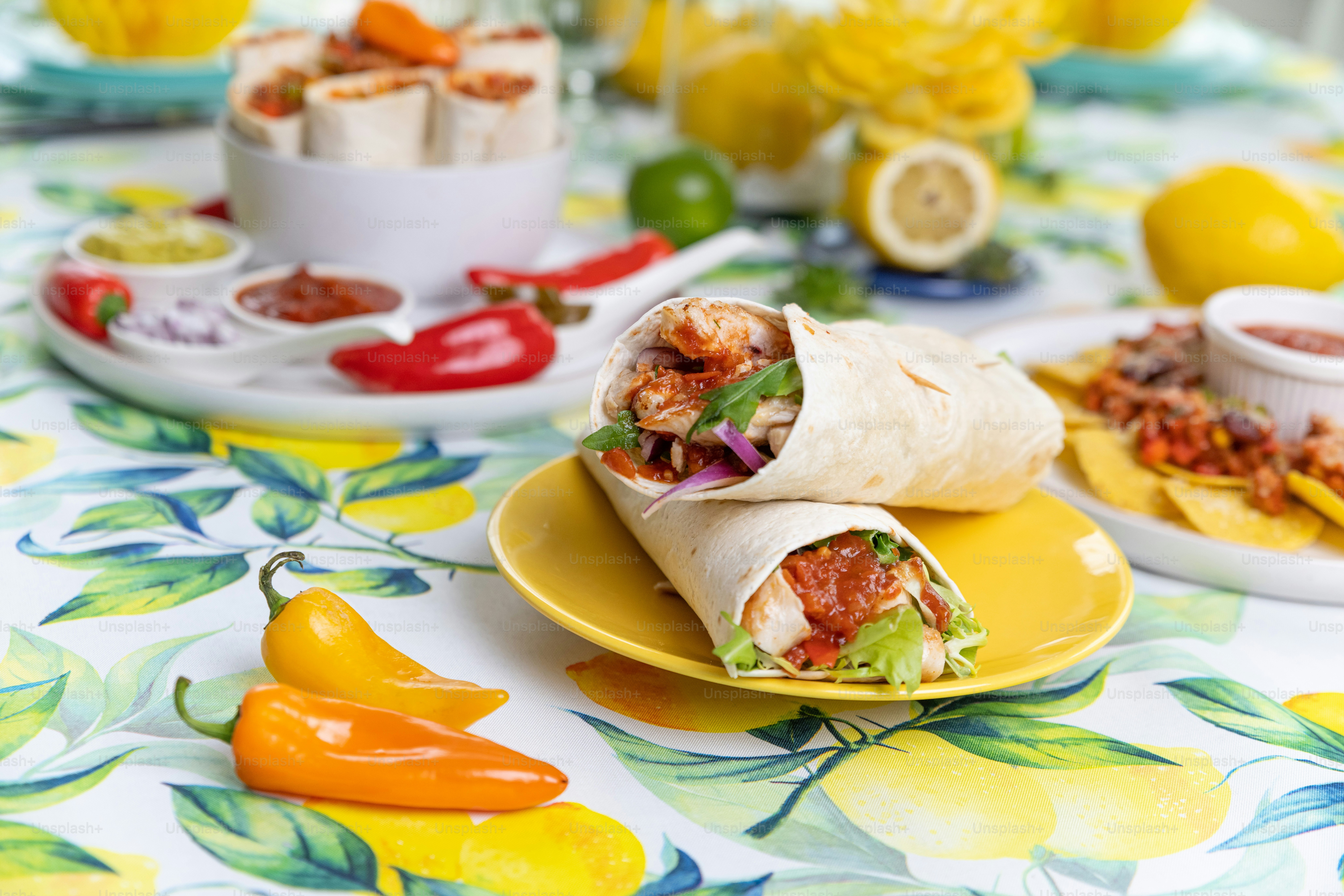 a plate with a burrito on it on a table