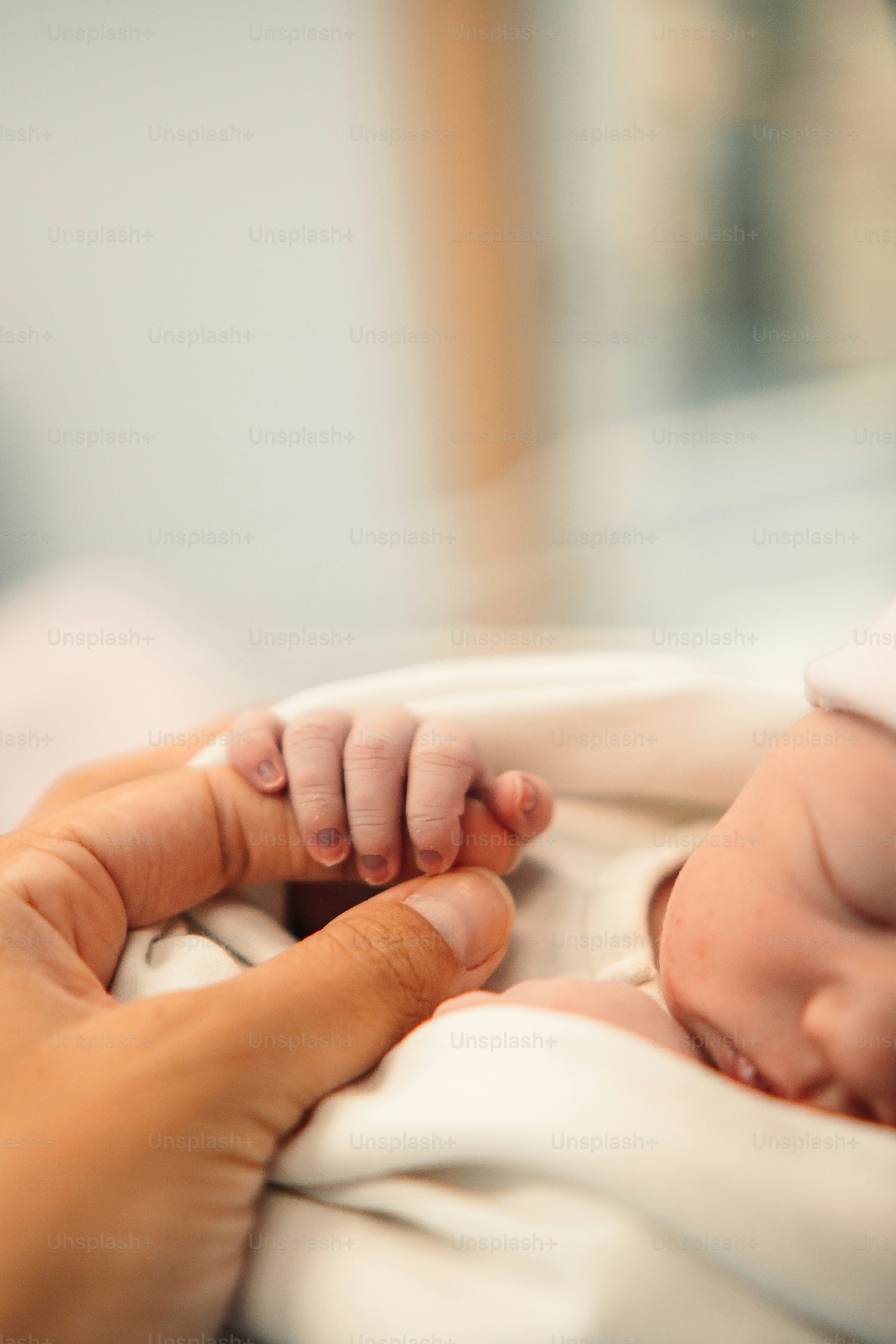 a woman holding a baby in her arms