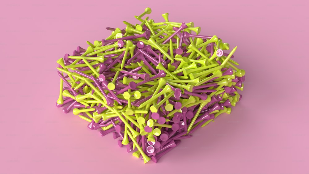 a pile of purple and green pins on a pink background