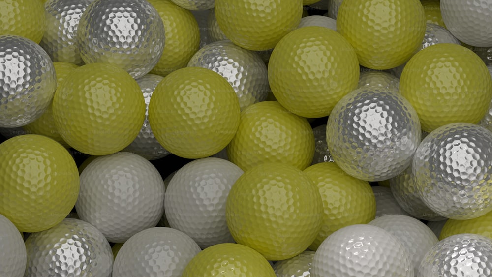 a pile of yellow and white golf balls