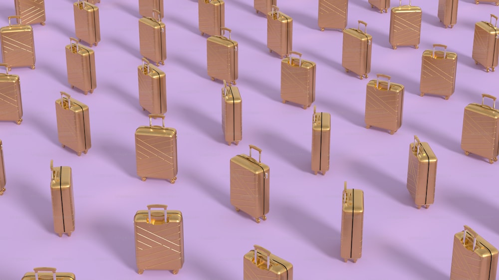 a group of gold suitcases sitting on top of a purple floor