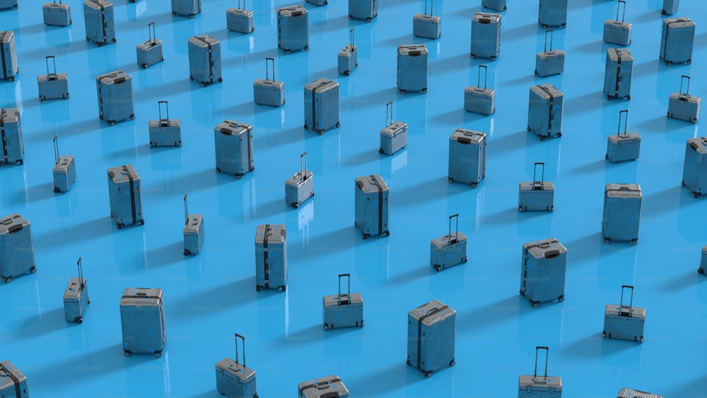 a bunch of suitcases that are on a blue surface