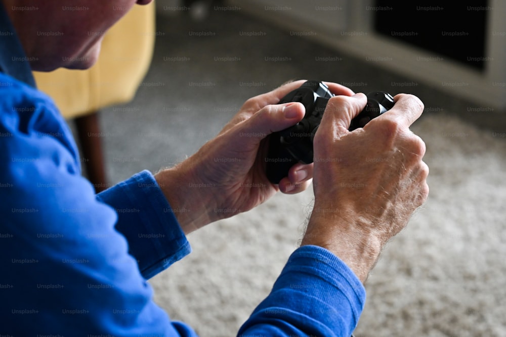 a man holding a remote control in his hand