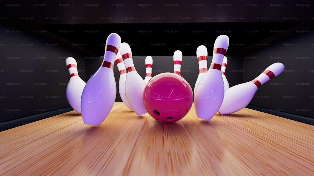 Una palla da bowling che si schianta contro i birilli di una pista da bowling