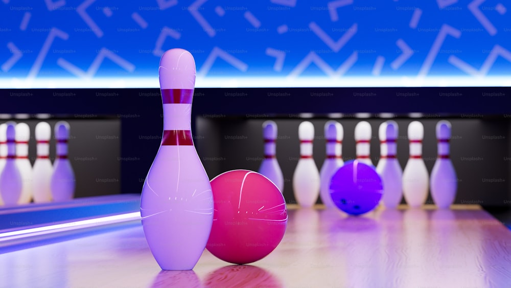 a bowling ball and a bowling pin on a bowling alley