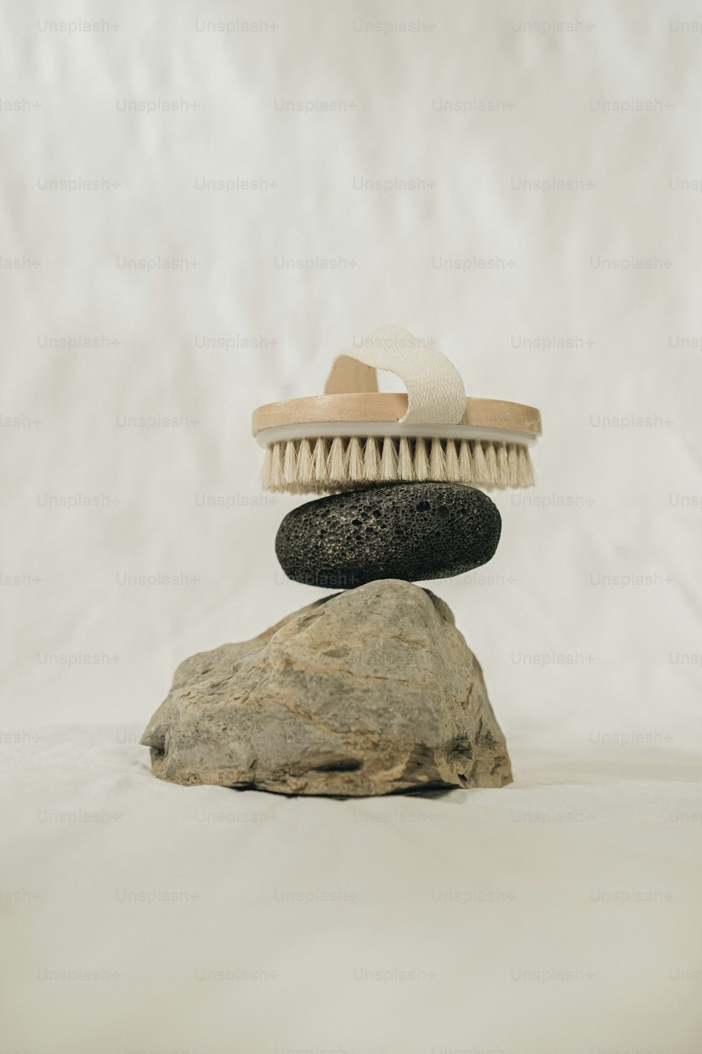 a pile of rocks with a brush on top of it