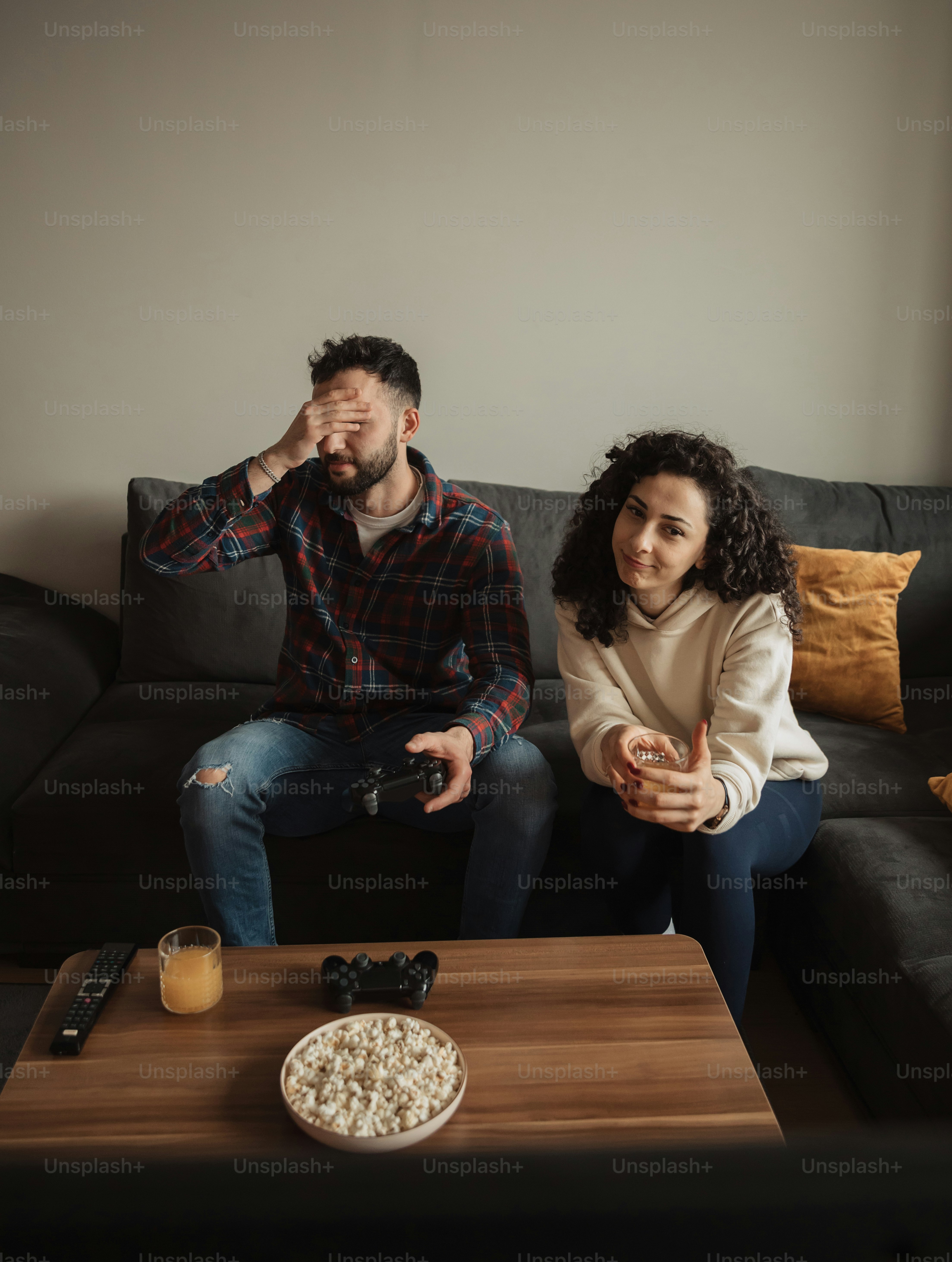 a man and a woman sitting on a couch