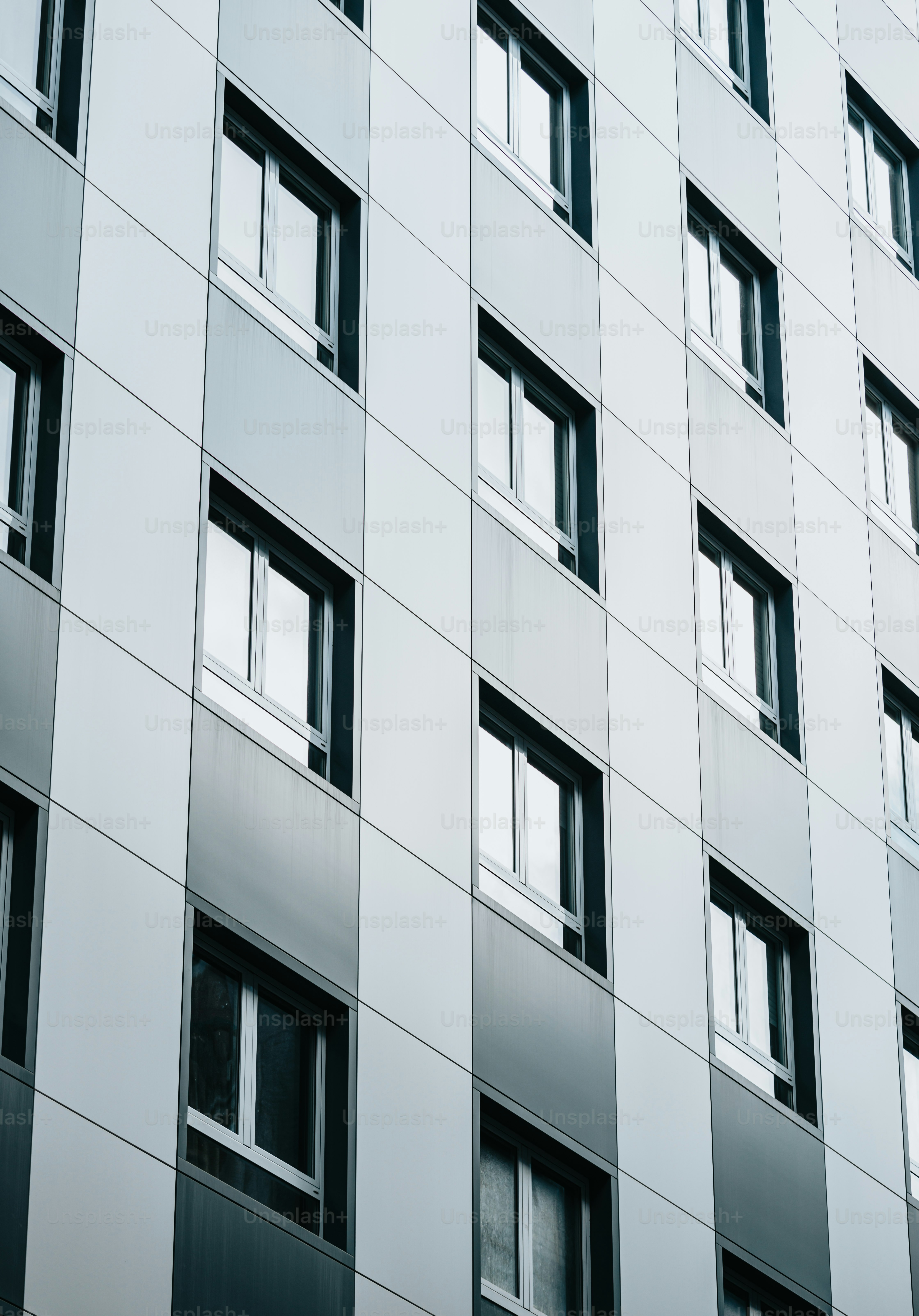 A very tall building with lots of windows photo – Architecture Image on ...
