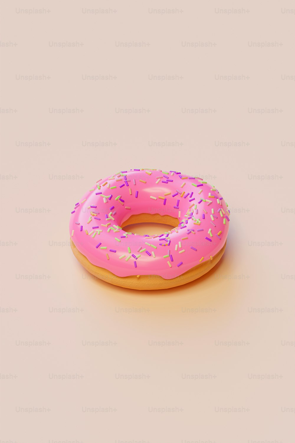um donut rosa com polvilhos sobre ele
