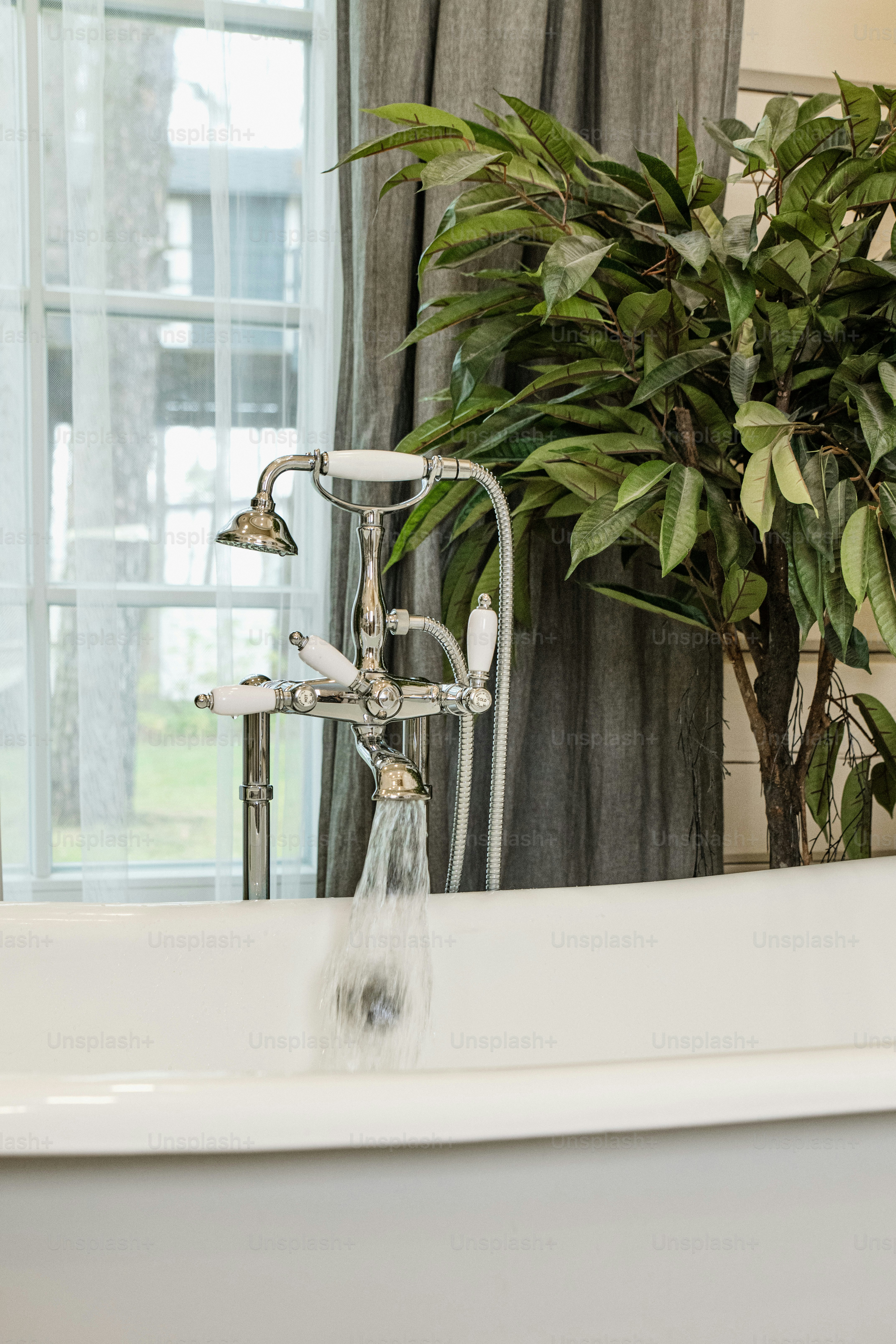 a white bath tub sitting next to a window