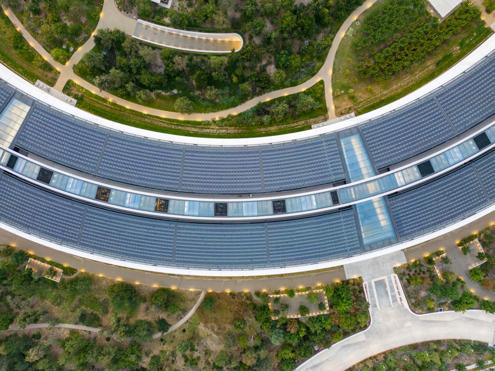 an aerial view of a building with solar panels