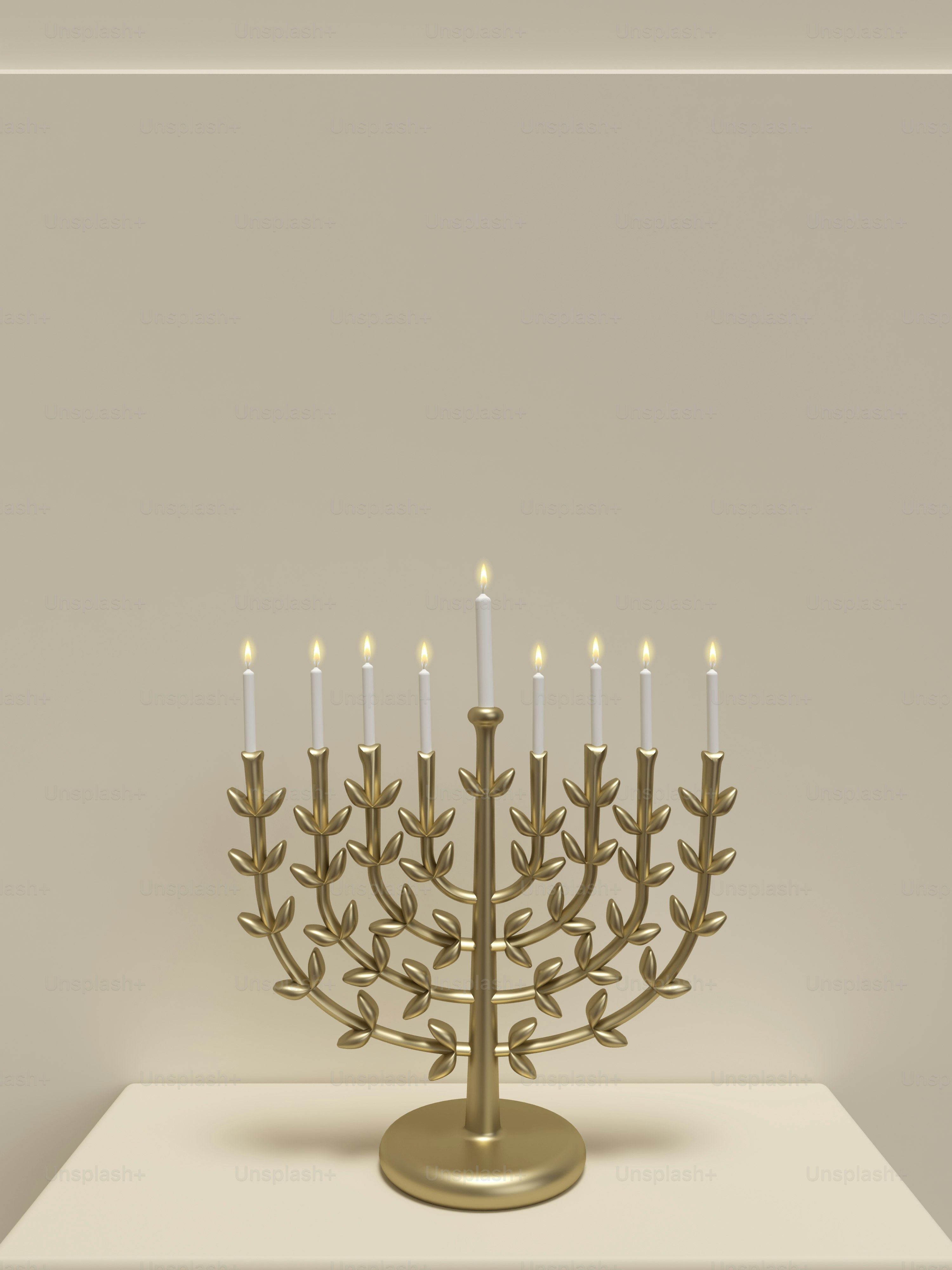 a golden menorah with lit candles on a table