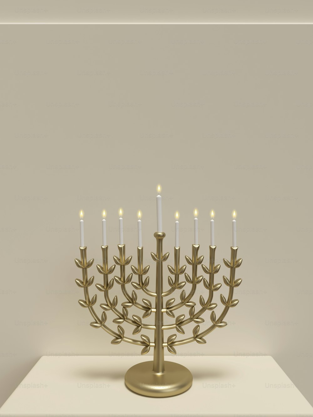 a golden menorah with lit candles on a table