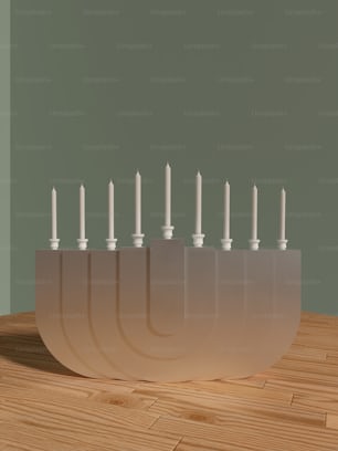 a group of white candles sitting inside of a bowl