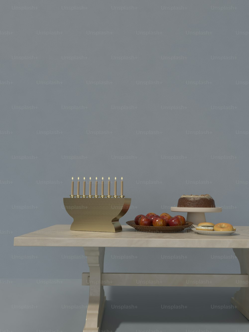 ein Tisch mit einem Kuchen und einer Schale mit Obst