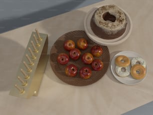 a table topped with donuts and a plate of donuts